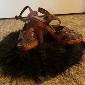 Wooded Bebe platform sandals.